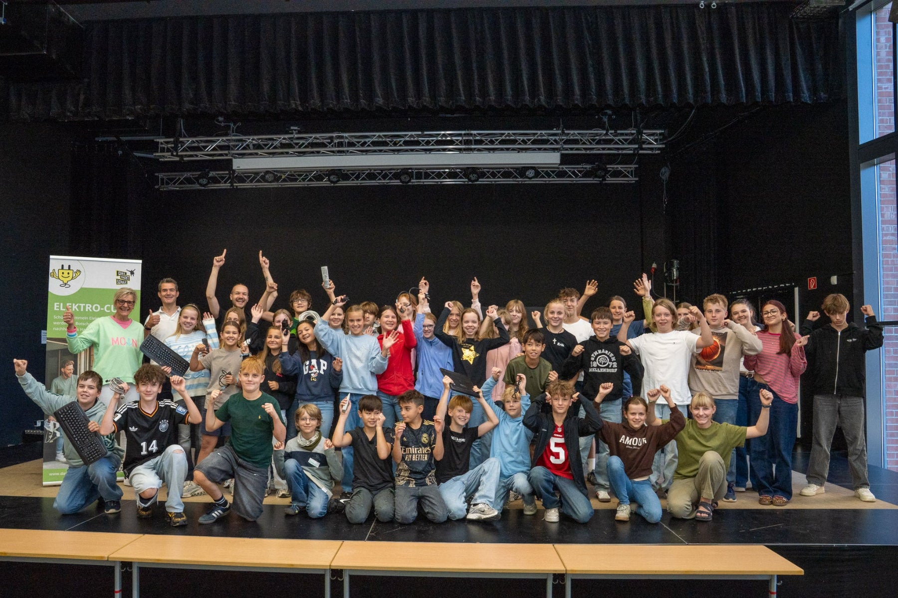 School class standing on a stage