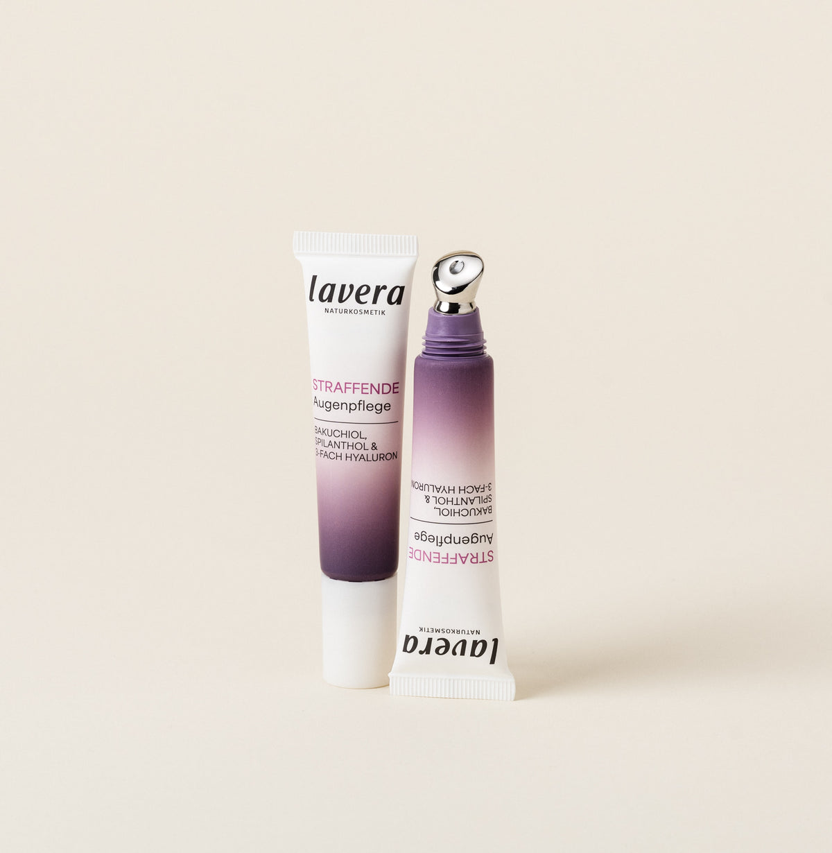Two lavera firming eye care products in purple packaging are set against a light background.