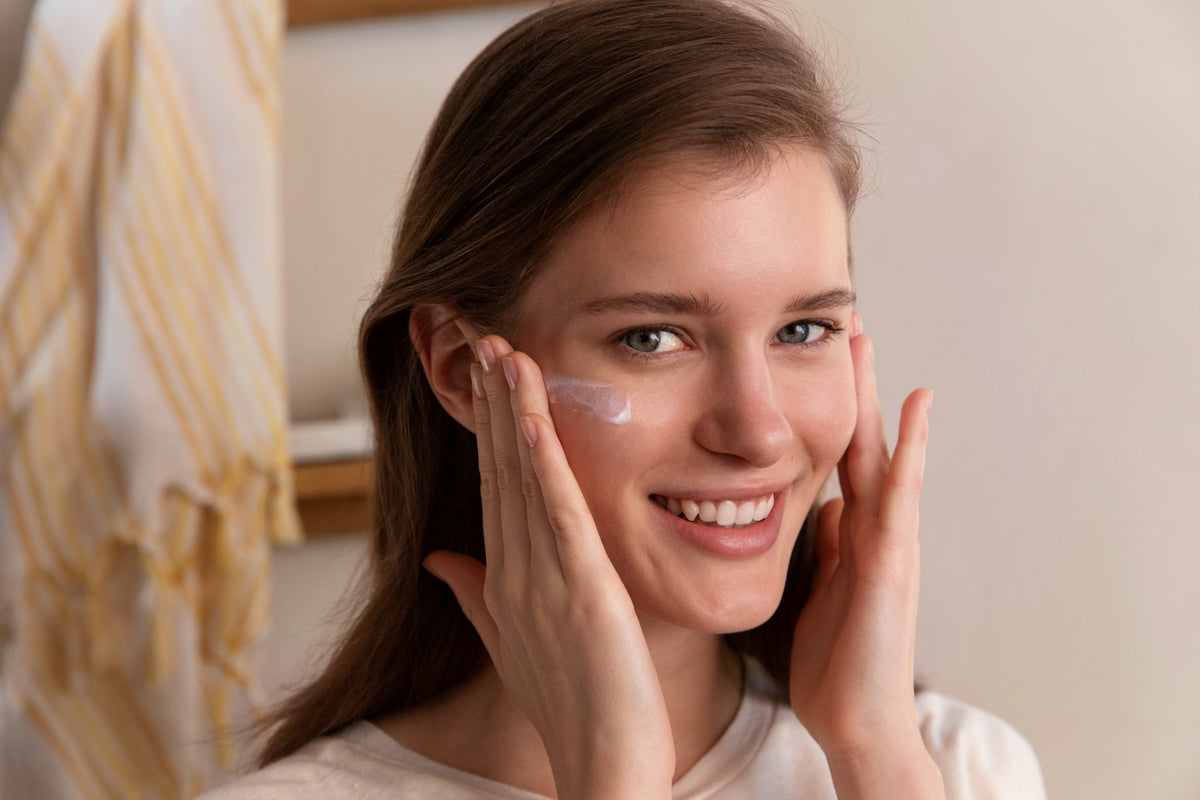 Brown-haired woman applies Anti UV Fluid to her face