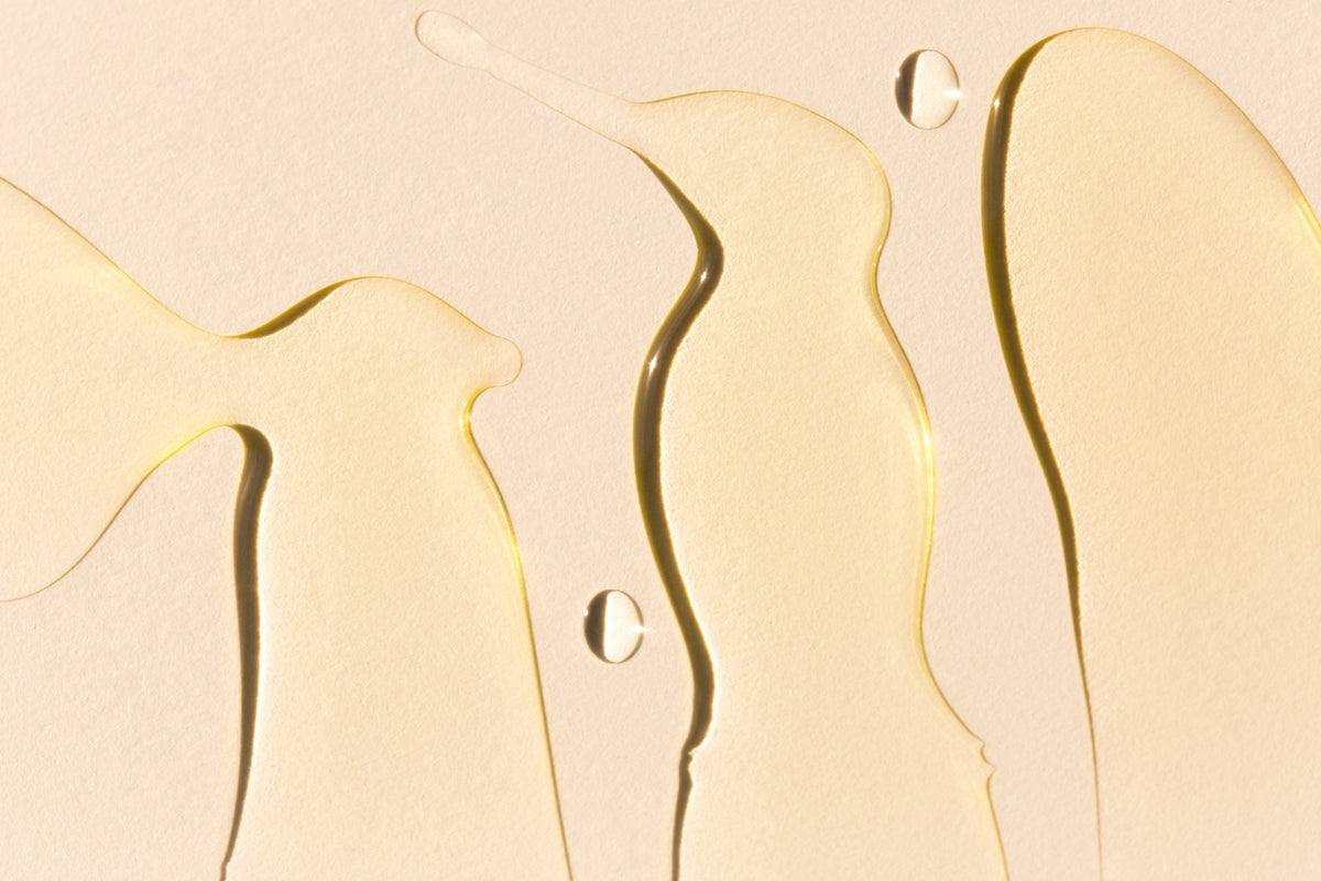 Transparent liquid against a beige background