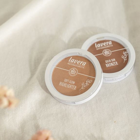 Soft Glow Highlighter and Solid Sun Bronzer side by side